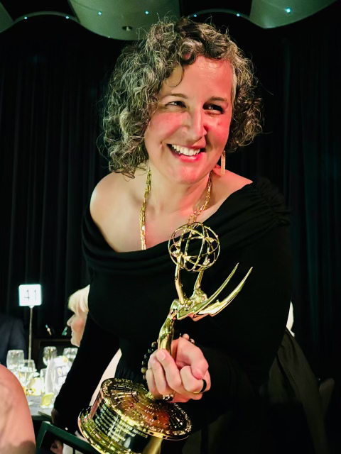 Rachel Farha holding Emmy trophy